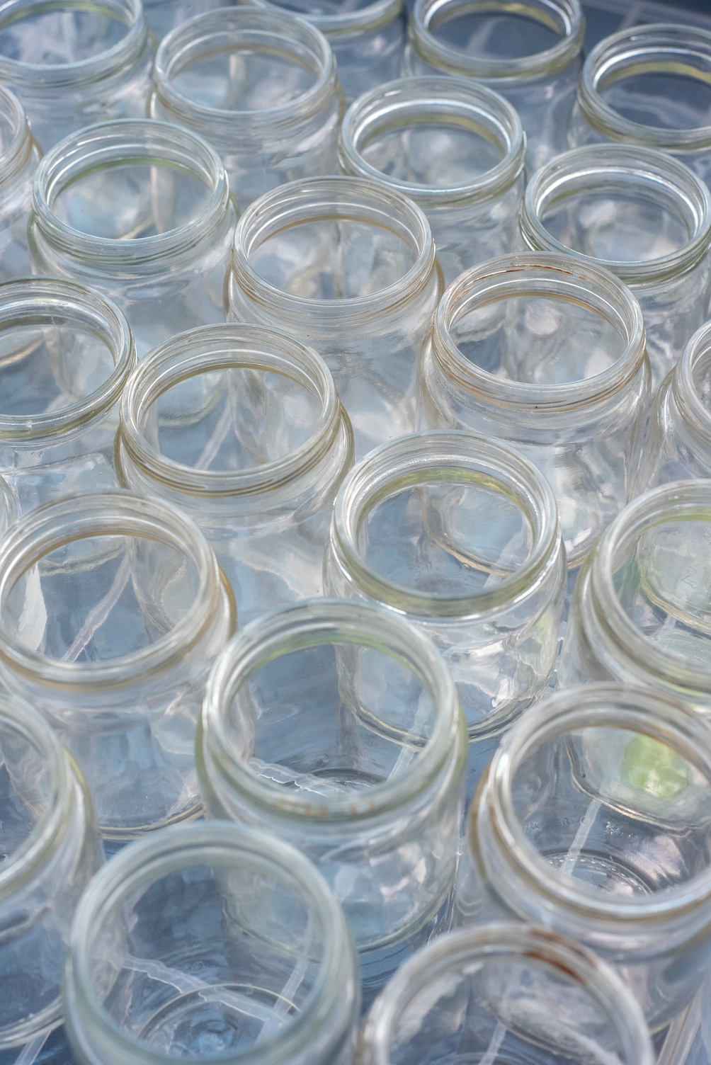 Sorting and collection of glass containers for recycling and reuse.